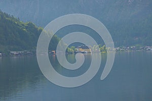 Hallstatter lake near Hallstatt village with cloudy sky in Austrian Alps.