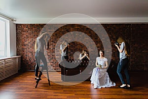 Hallucination of a bride with four photographers