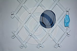 Hallway cloakroom with a mask and a blue hat