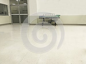 Hallway infront of emergency room ward in hospital with nobody on bed