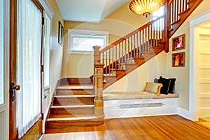 Hallway interior. Old staircase with bench