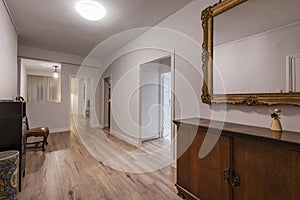 Hallway of a vacation rental home with a beautiful gilt-frame photo