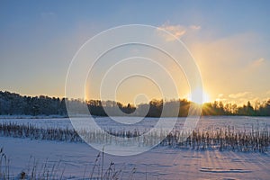 Halo effect over a field covered with snow.