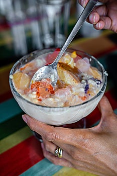Halo-halo is a colorful Filipino beverage of crushed ice an mixtures of bean, jello, milk and many more