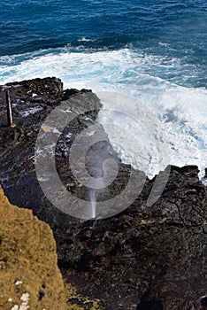 Halona Blowhole spraying water through its lava tube