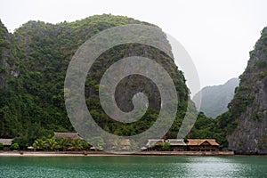 Halong Bay in mystical clouds. Mystical atmoshpere in the world famous halong bay.