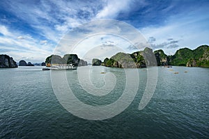 Halong bay with tourist junks and rocky islands. Popular landmark, famous destination of Vietnam