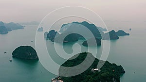 HALONG BAY, VIETNAM - APRIL, 2020: Aerial panorama view of the inhabited rocky island of Halong Bay in Vietnam.