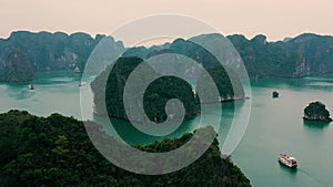 HALONG BAY, VIETNAM - APRIL, 2020: Aerial panorama view of rocky islands with tropical forests of Halong Bay in Vietnam.