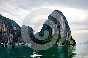 Halong Bay, Vietnam. Scenic view of rock islands and sailboats in the ocean.