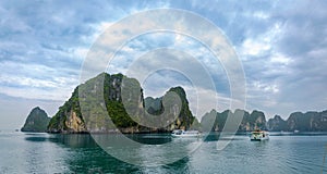 Halong Bay, Vietnam. Scenic view of rock islands and sailboats in the ocean.