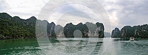 Halong Bay, Vietnam. Scenic view of rock islands and sailboats in the ocean.