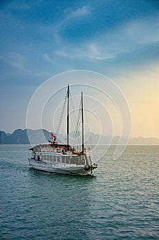 Halong Bay, Vietnam. Scenic view of rock islands and sailboats in the ocean.