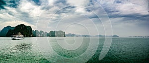 Halong Bay, Vietnam. Scenic view of rock islands and sailboats in the ocean.