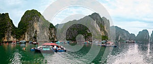 Halong Bay, Vietnam. Scenic view of rock islands and sailboats in the ocean.