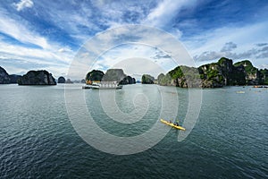 Halong bay in Vietnam, UNESCO World Heritage Site, with paddling kayak.