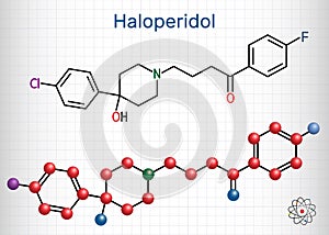 Haloperidol molecule, is antipsychotic medication. Structural chemical formula and molecule model. Sheet of paper in a cage.