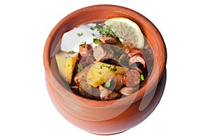 Halophyte with sausages, lemon and sour cream in a pot photo