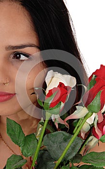 Halve of a face of a woman with roses