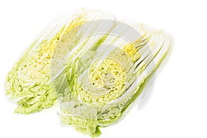 Halved Chinese cabbage or petsai isolated on a white background