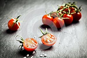 Halved fresh ripe grape tomato photo
