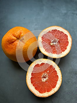 halved grapefruit, juicy fruit, fruit with a bitter taste, citrus fruit, juicy fruit, peel group