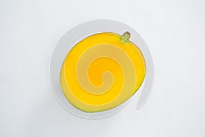 Halved mango on white background