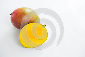 Halved mango on white background