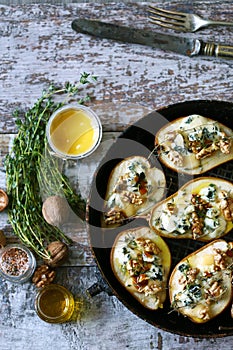 Halved Pears in a pan baked with Dorblu cheese, honey, walnuts and thyme.
