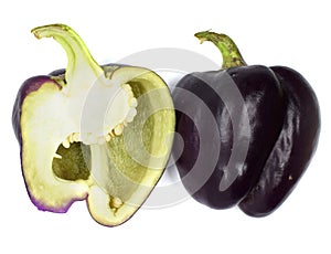 Halved purple bell pepper isolated on a white background