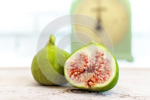 Halved, ripe figs in vintage/retro kitchen setting