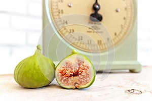 Halved, ripe figs in vintage/retro kitchen setting