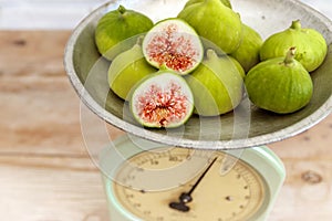 Halved, ripe figs in vintage/retro kitchen setting