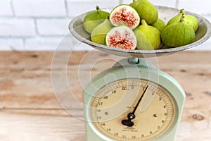 Halved, ripe figs in vintage/retro kitchen setting