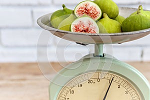 Halved, ripe figs in vintage/retro kitchen setting