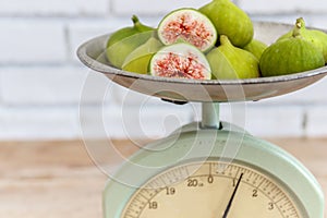 Halved, ripe figs in vintage/retro kitchen setting