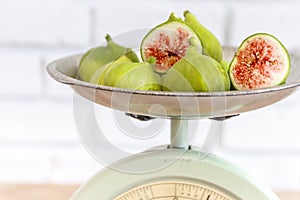 Halved, ripe figs in vintage/retro kitchen setting