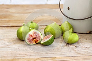 Halved, ripe figs in vintage/retro kitchen setting