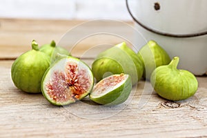 Halved, ripe figs in vintage/retro kitchen setting