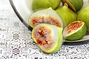 Halved, ripe figs in vintage/retro kitchen setting