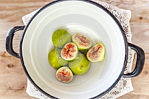 Halved, ripe figs in vintage/retro kitchen setting