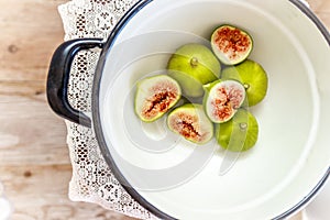 Halved, ripe figs in vintage/retro kitchen setting