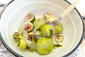 Halved, ripe figs in vintage/retro kitchen setting