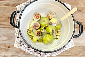 Halved, ripe figs in vintage/retro kitchen setting