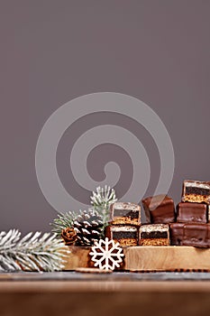 Halved taditional German sweets called \'Dominosteine\'. Christmas candy consisting of gingerbread, jelly and marzipan
