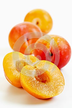 Halved yellow plums
