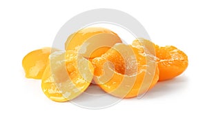 Halves of canned peaches on white backgroun