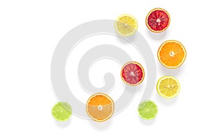 Halves of citrus fruits isolated on white background. Fresh orange, lime, red blood orange and lemon. Top view