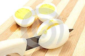 Halves of eggs with ceramic knife