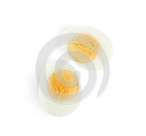 Halves of fresh hard boiled chicken egg isolated, top view